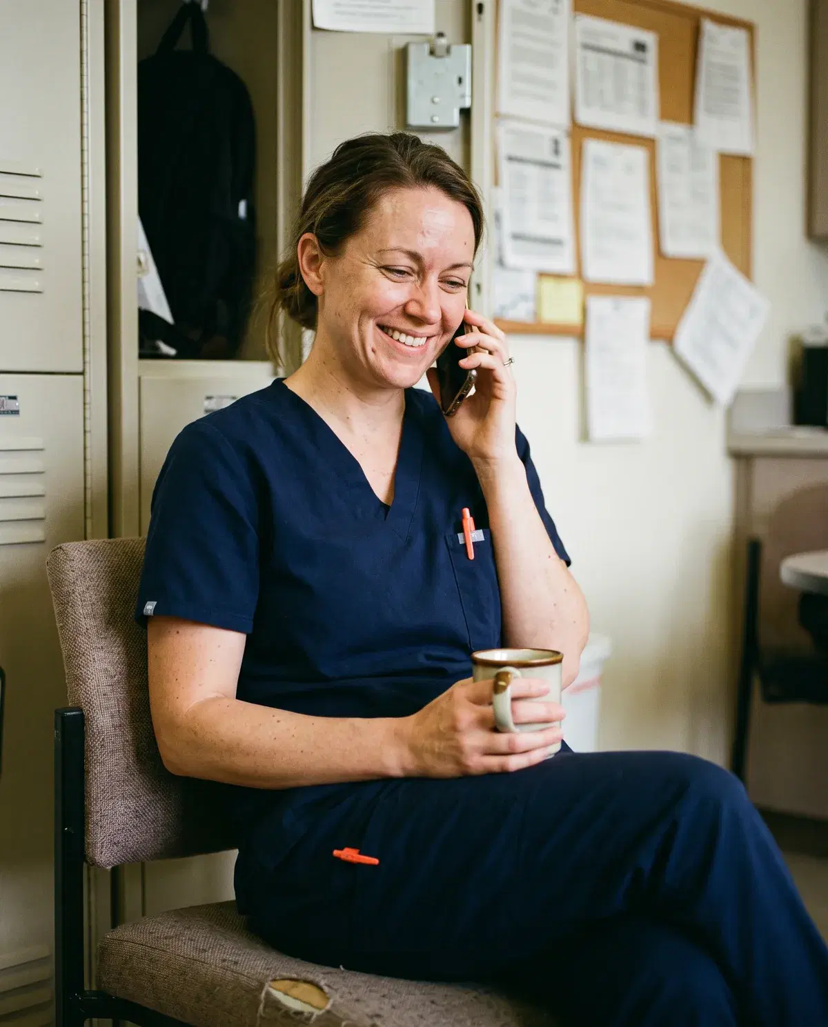 A care worker on her phone between visits